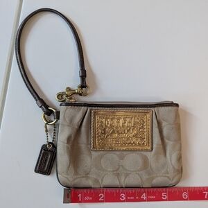 Coach Beige Leather Clutch with Metallic Accents